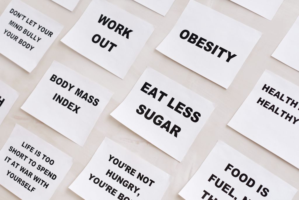 Collection of motivational notes promoting health and wellness found on paper notes.