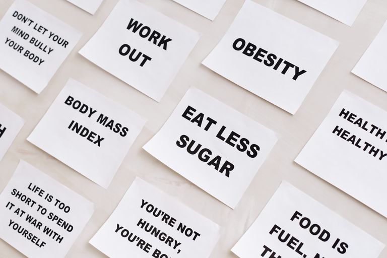 Collection of motivational notes promoting health and wellness found on paper notes.